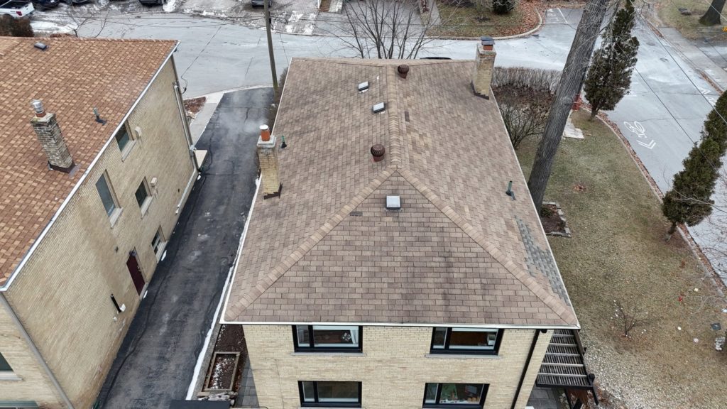 Worn asphalt roof on a Mississauga home before its metal roof replacement